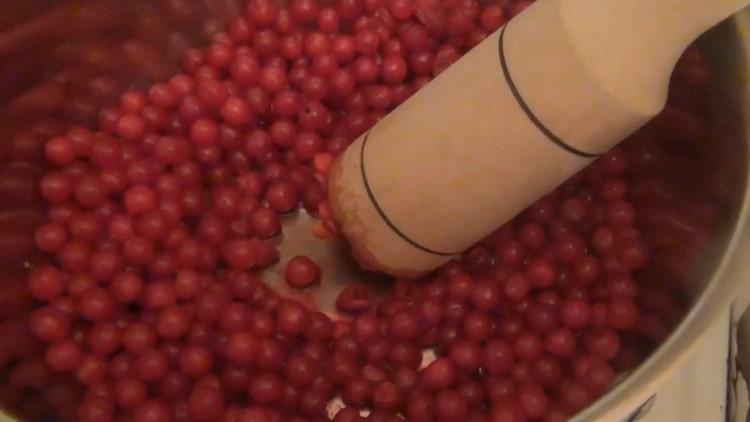 put the berries in a pan and knead them with a crush.
