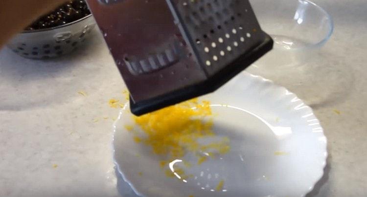Rub the lemon zest on a fine grater.