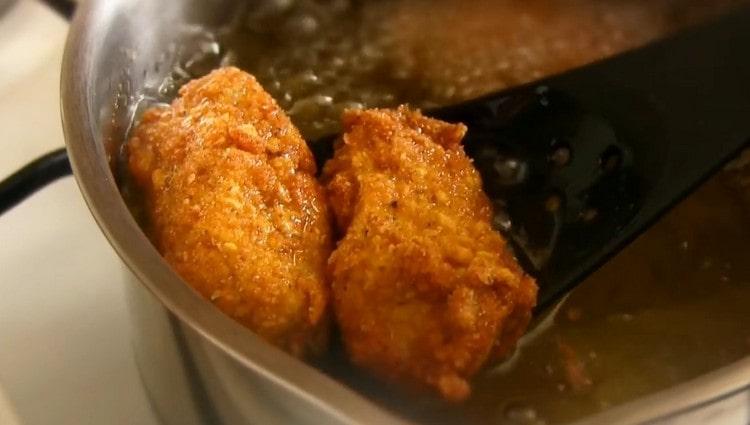 Fry the meat until golden brown.