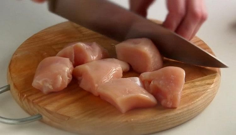Cut each half of the meat into small pieces.