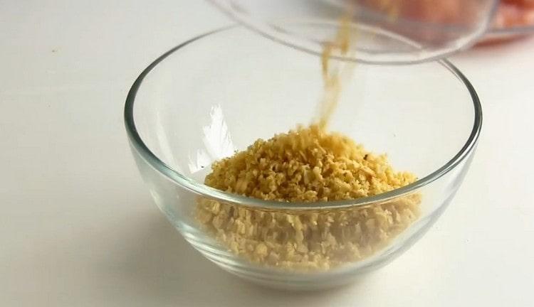 Grind regular potato chips into crumbs.