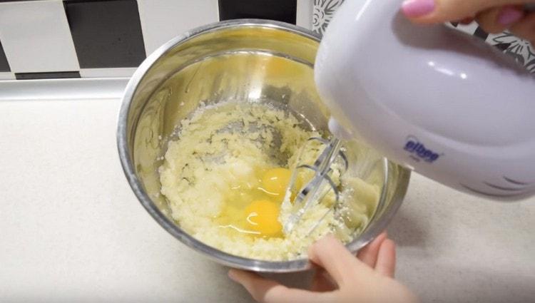 Add two eggs and beat again.