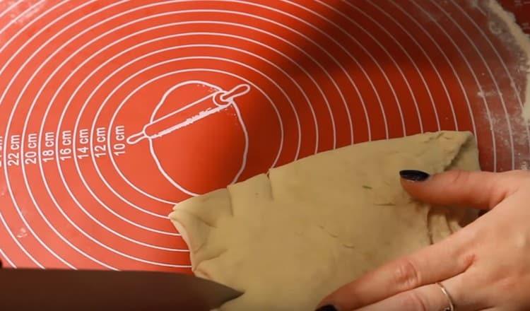 we roll out the second piece of dough, then fold it four times and make such oblique incisions.