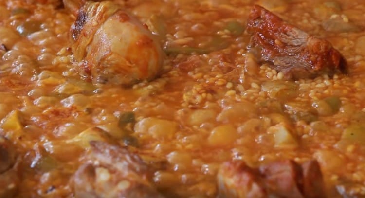 Cooking a dish over low heat.