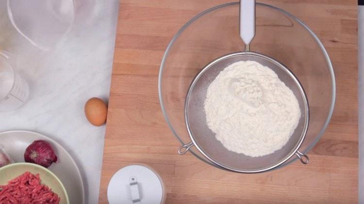 Sift flour into a bowl.