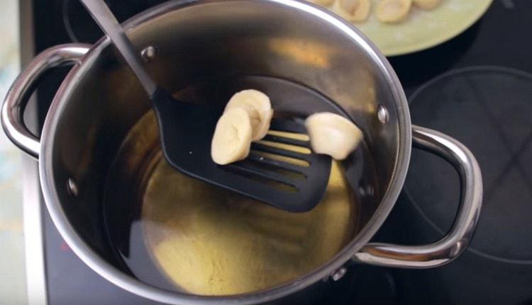 Gently spread the dumplings in the butter.