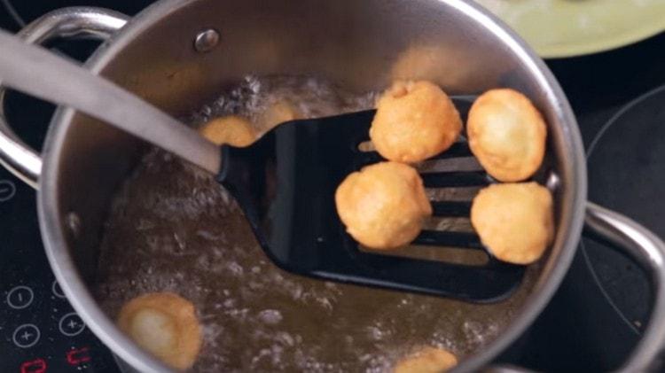Deep-fried dumplings until golden brown.