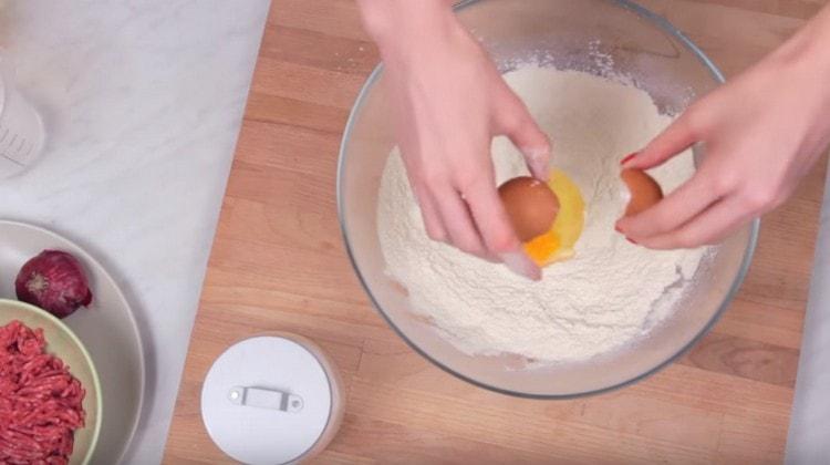 We beat the egg into the flour.