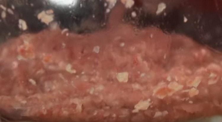 Add salt, pepper. water and mix the minced meat.