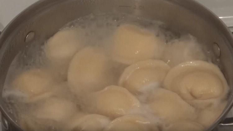 Cook the dumplings until they pop up.