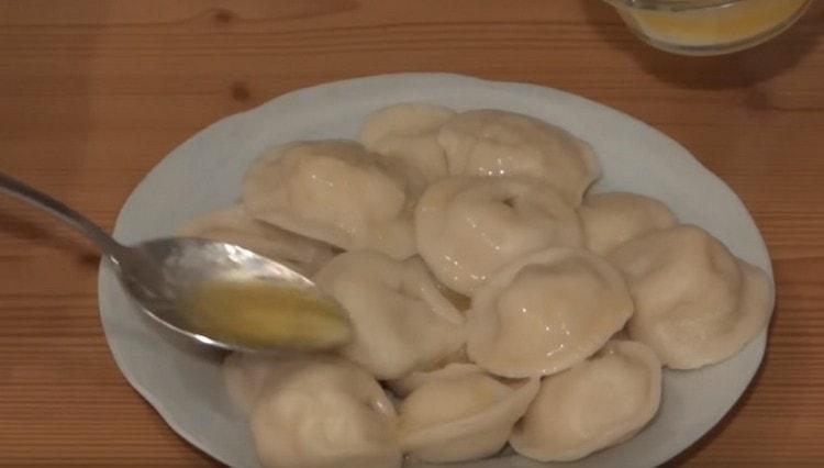 Ready dumplings with potatoes are watered before serving with melted butter.