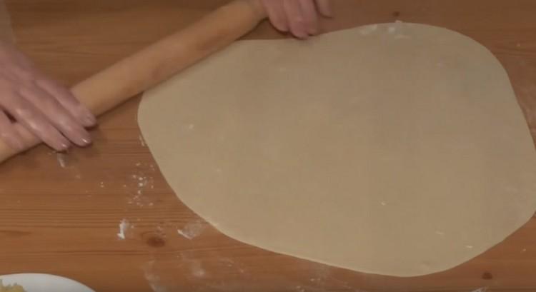 Thinly roll the finished dumplings dough.