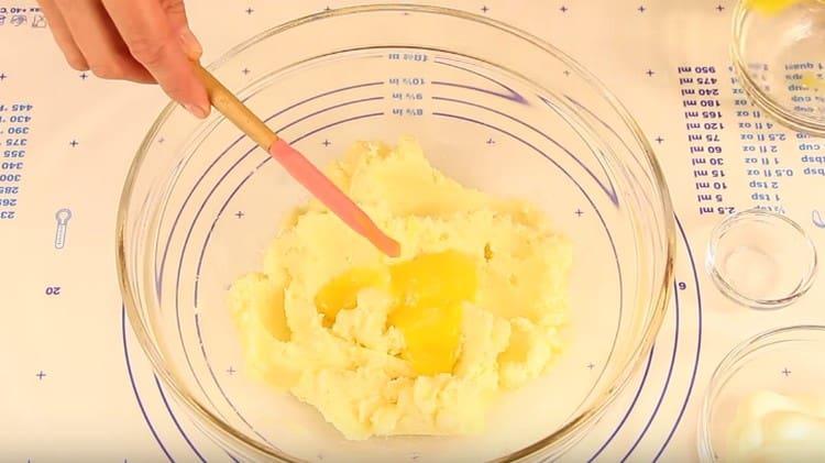 Add two yolks to the oil mass.