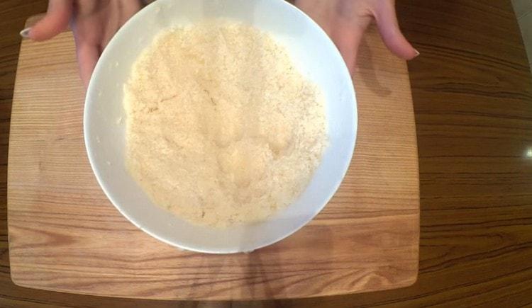 Add coconut flakes to the egg mass and mix it all.