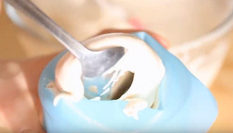 We shift the dough into a pastry bag.