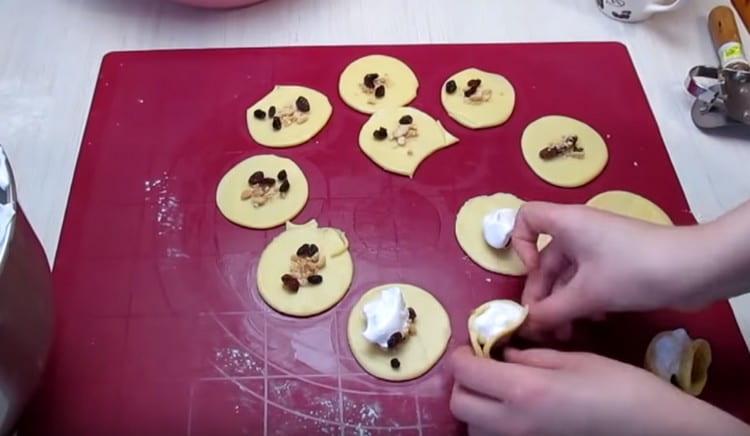 Fold the circles of dough in half.