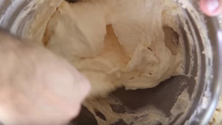 Add the flour in parts and mix gently as well.