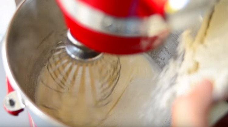 Add flour to eggs with sugar.