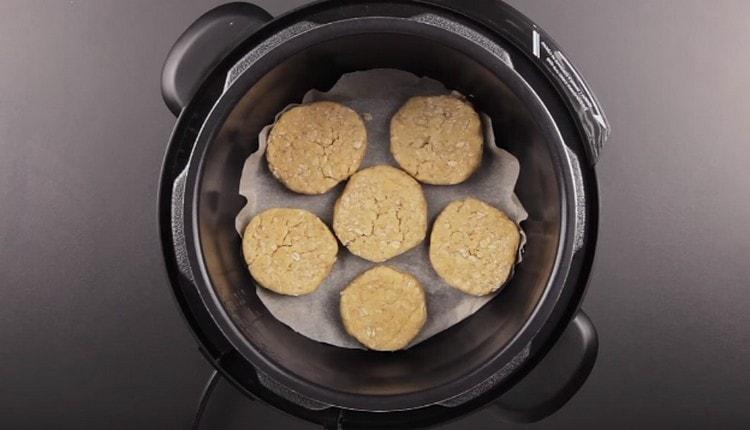 We spread cookies on parchment.