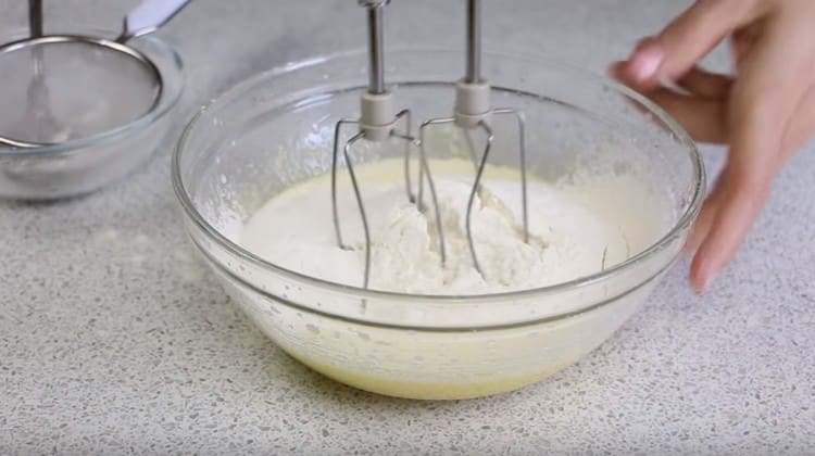 Add the flour and mix the dough.