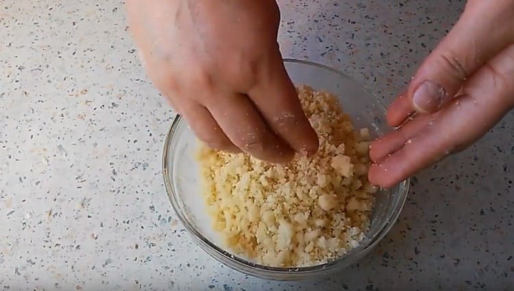 Hand rub this mass into crumbs.