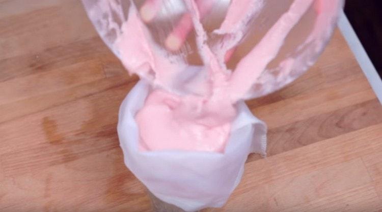 We shift the dough into a pastry bag.