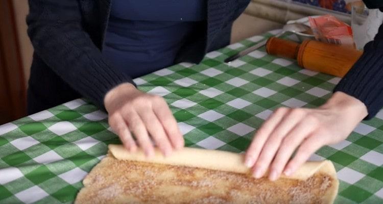 Gently roll the dough into a tight roll.