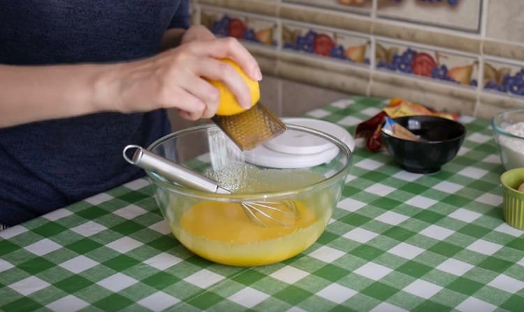 Rub the lemon zest into the dough.