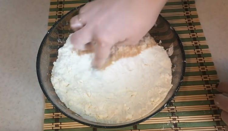 Add sugar and grind again until crumbs are formed.