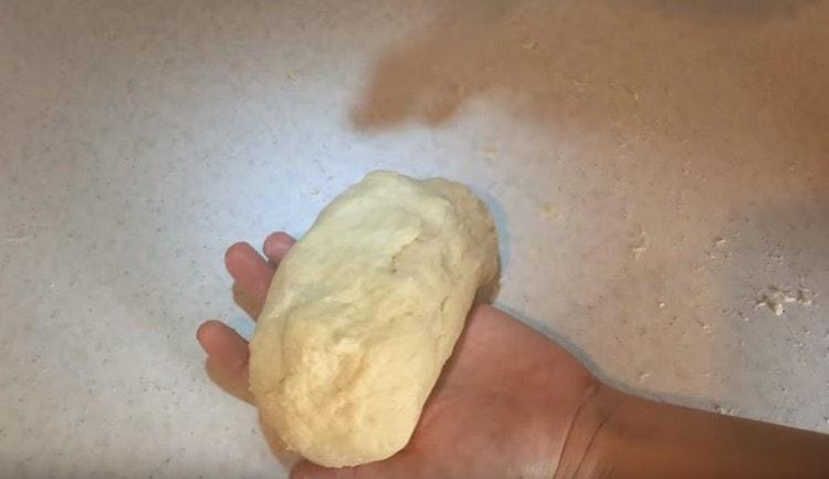 Knead soft plastic dough.