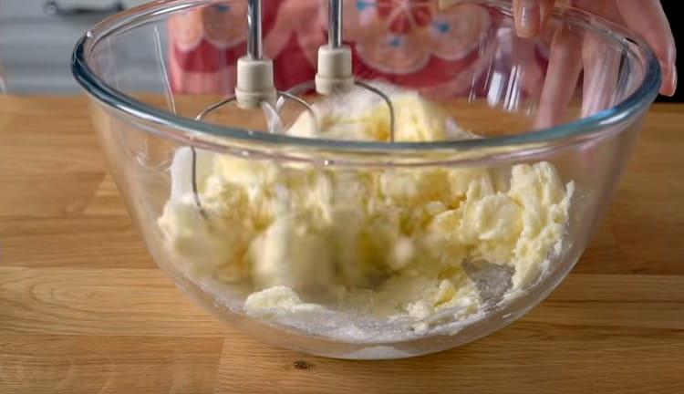 Beat butter with sugar with a mixer.