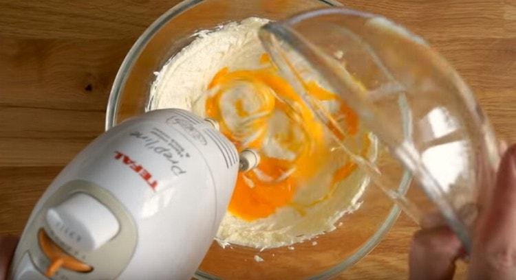 Add salt, vanilla sugar and yolks to the oil mass.