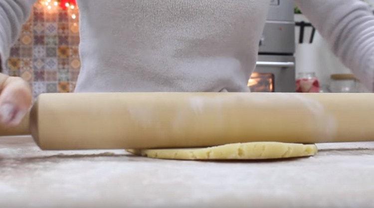 Roll out the dough with a rolling pin.