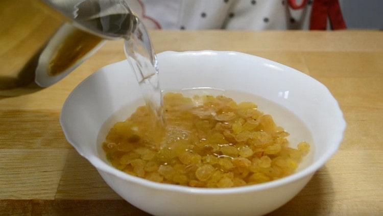 Pour raisins with boiling water.