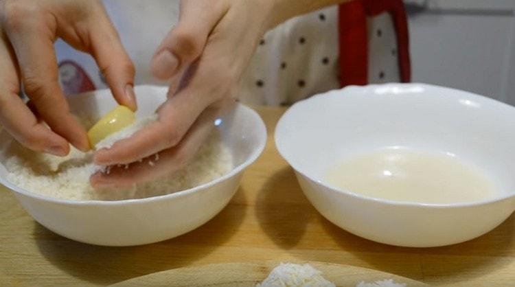 Dip each cookie in icing, and then roll in coconut.