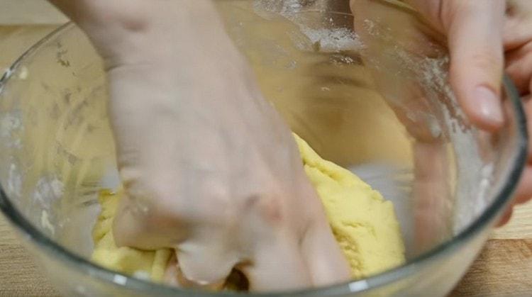 Then you need to knead the dough with your hands a little.