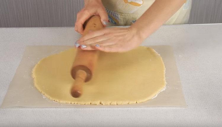It is convenient to roll out such dough directly on a sheet of parchment.