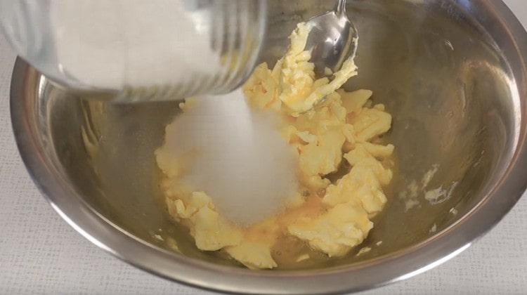 Add sugar to the oil mass.