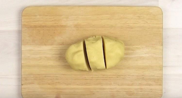 We divide the dough into three parts.