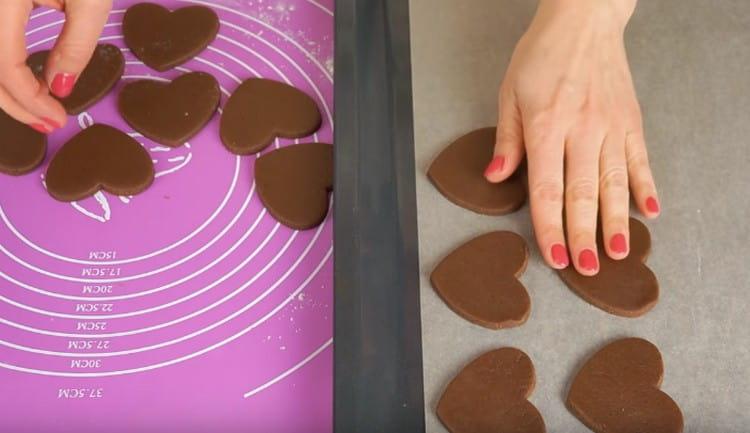 We shift our hearts onto a laid baking sheet.