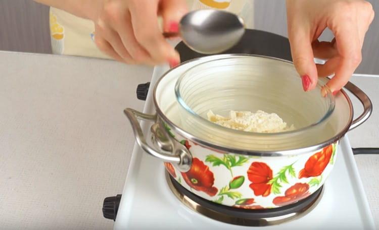 Set a bowl of chocolate in a water bath and melt it.