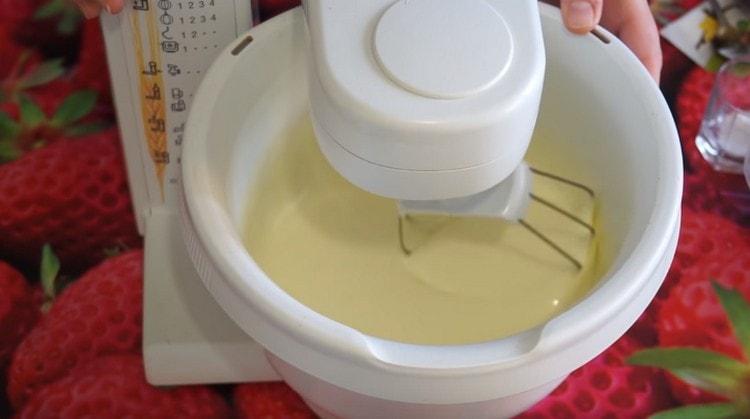 Add sugar to the eggs and beat until lush light mass.