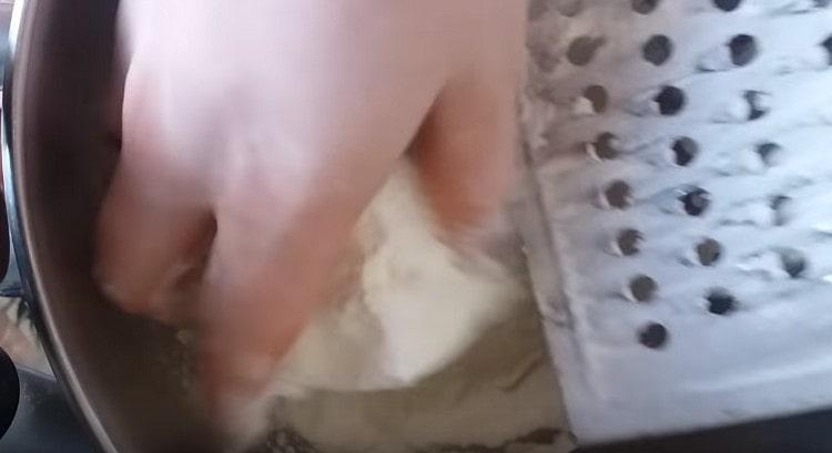 Rub the margarine into the flour.