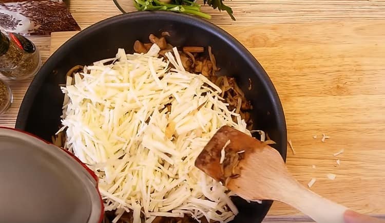 Add cabbage to the pan, as well as a little water.