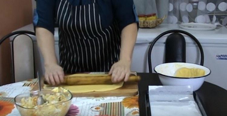 We roll out most of the dough with a rolling pin.