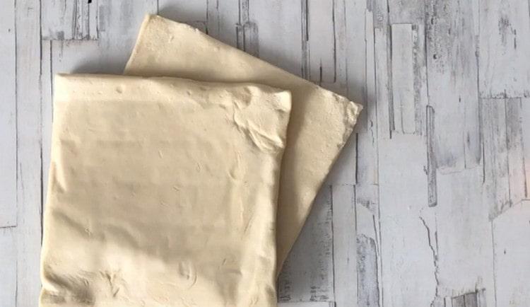 Defrost two sheets of puff yeast dough.