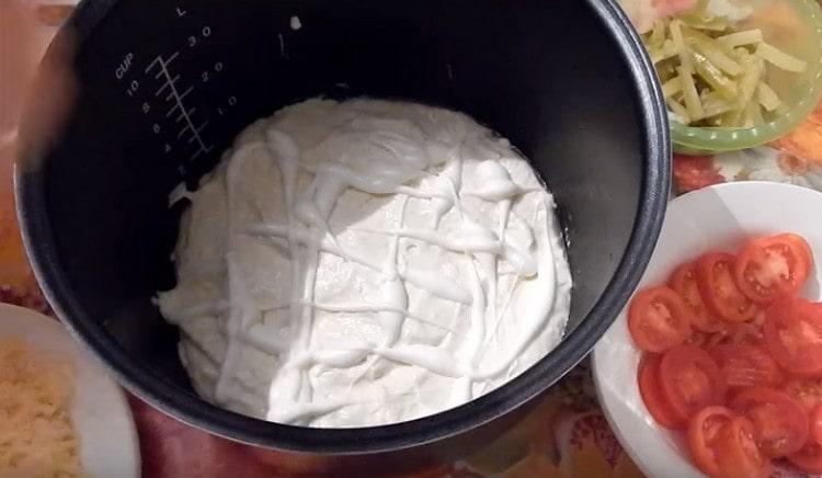 Dough can be greased with mayonnaise, ketchup or other sauce to taste.