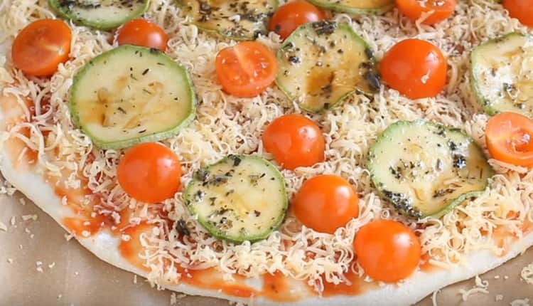 On cheese we spread circles of zucchini and cherry tomatoes.
