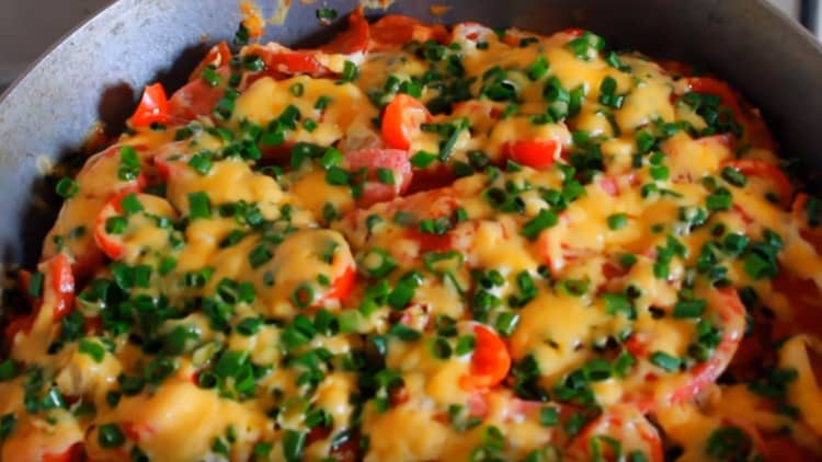 Cover the pizza again to melt the cheese.