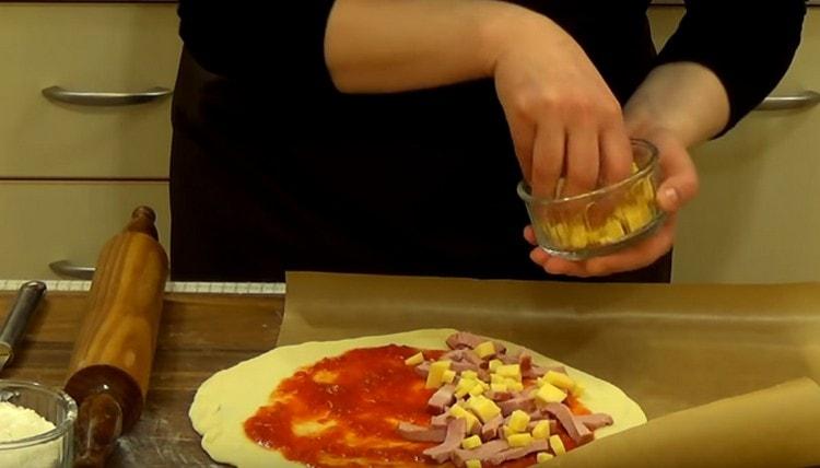 Next, add the pieces of cheese.